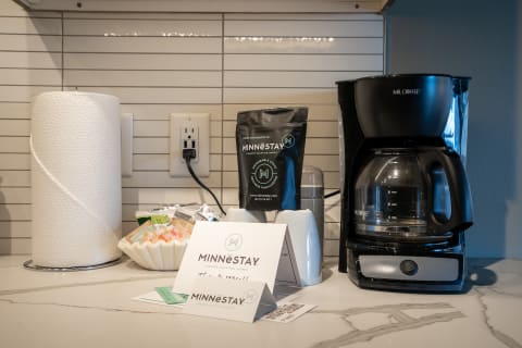 Coffee station in a modern kitchen with a Mr. Coffee machine and Minnestay coffee bag.