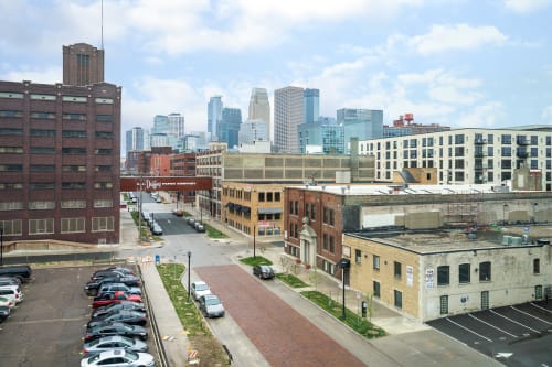 Downtown skyline view showcases the vibrant urban landscape with modern high-rises and historic brick buildings creating a dynamic cityscape backdrop.