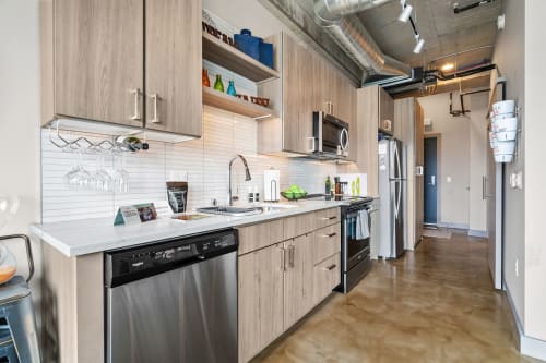 Your sleek modern kitchen features stainless steel appliances, quartz countertops, and everything you need to create memorable meals during your stay.