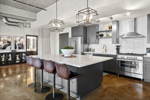 Step into your sleek modern kitchen featuring premium appliances, spacious island seating, and industrial-chic design perfect for culinary adventures.