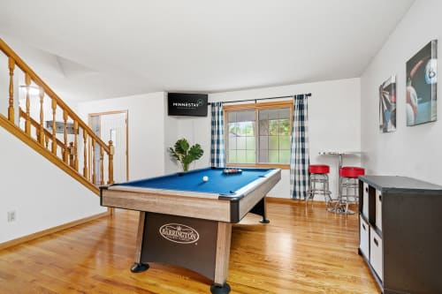 Challenge friends to pool in your private game room, complete with bar seating and entertainment for memorable evenings together.